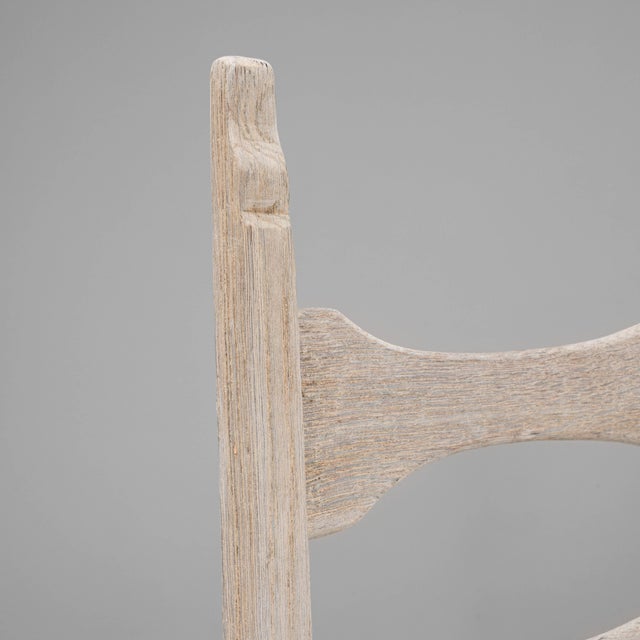 This set of six 1900s French oak dining chairs showcases timeless craftsmanship and rustic charm. Each chair is expertly...