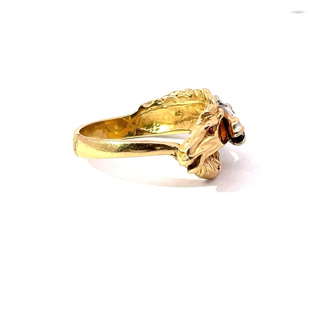 A bold and sculptural equestrian statement piece crafted in solid 14k yellow and white gold. This bypass-style ring...