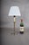 Silvering brass was a common finishing technique for candlestick-form lamps, prized for its cool, reflective shine layered...
