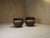 A pair of mid century lounge chairs, handcrafted from solid palm wood. Their sculptural, organic forms showcase the...