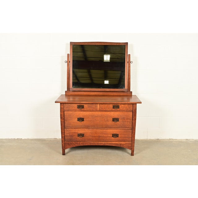 A rare and exceptional antique Mission or Arts & Crafts period four-drawer dresser or chest of drawers with mirror By...
