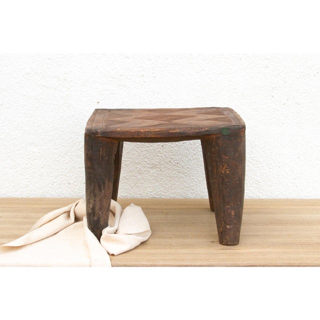 A unique piece of African art, this vintage Nupe table from Nigeria is a must-have for collectors and enthusiasts of Nupe...