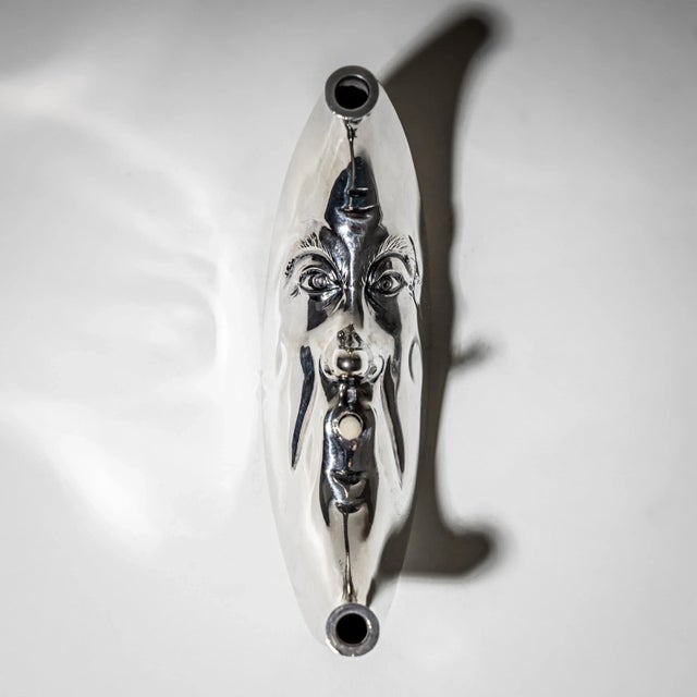 Unusual sterling silver cigar lighter modeled as a crescent moon with facial features. Hallmarked with the maker’s mark of...