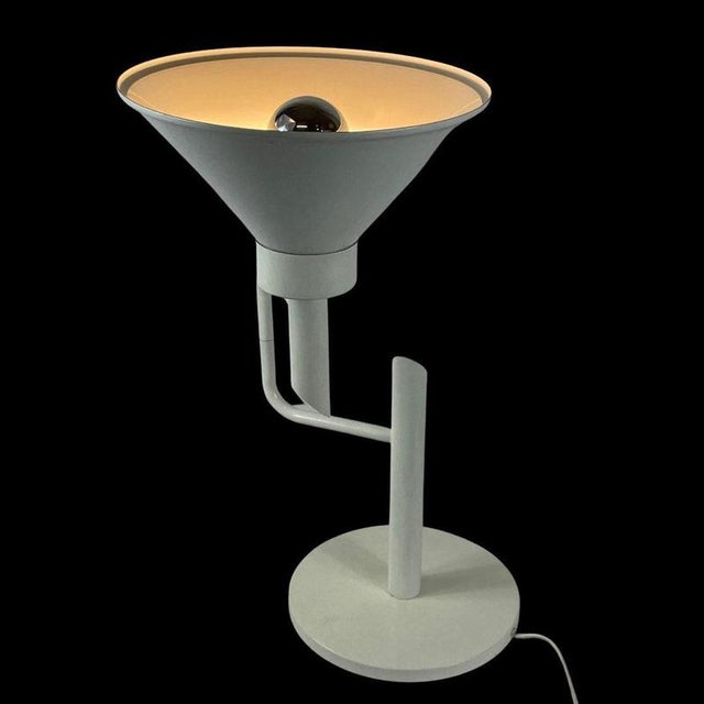 Unique desk lamp. It’s in great condition, minor user marks consistent with it’s age. The lamp comes including the bulb....