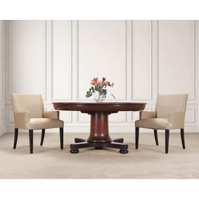 An elegant round English regency style mahogany pedestal dining table, screen-used on the first floor of Carrie Bradshaw's...