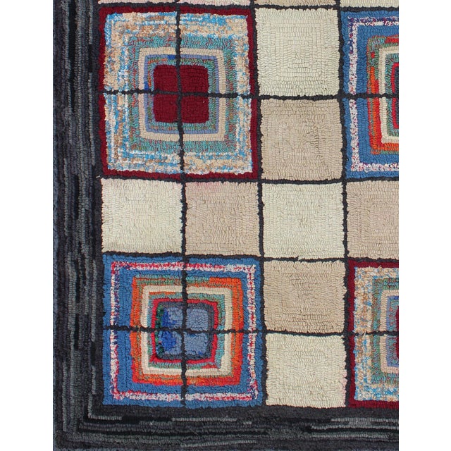 Ingenious in style, color and composition, the features in this spectacular, antique American Hooked rug create an...
