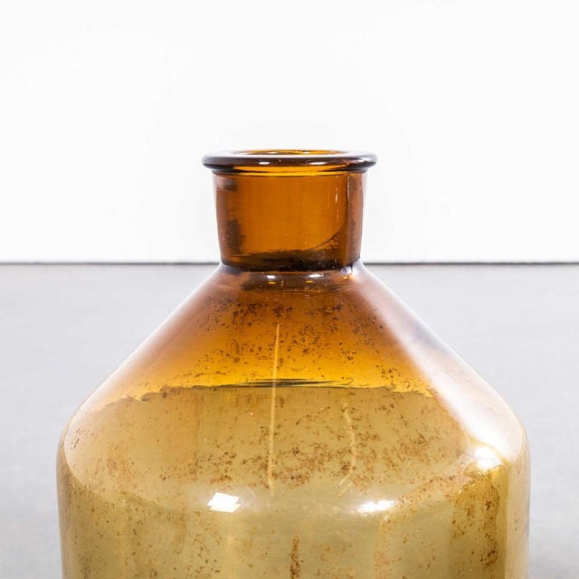 : vintage french amber glass vessels – pair. A pair of mouth blown glass vessels used as a traditional containers mainly...