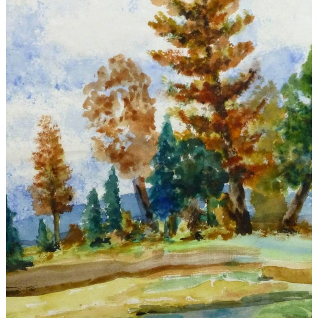 Joyful watercolor landscape of a strip of trees dotted with fall colored foliage by artist Alfred Siegris (1892-1960),...