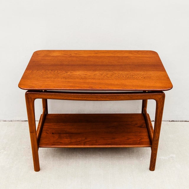 Vintage solid teak two tier side table with beveled edge, designed by Peter Hvidt & Orla Mølgaard-Nielsen and made in...