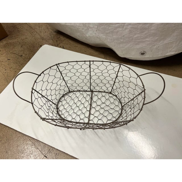 Vintage hand made wire basket with 2 side handles. Use as a bread basket or to store fruit / vegetables in. Great...