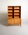Oak and woven rattan bookcase with 28 cm-deep adjustable shelves and a lower compartment closed by two doors. "Norrland"...