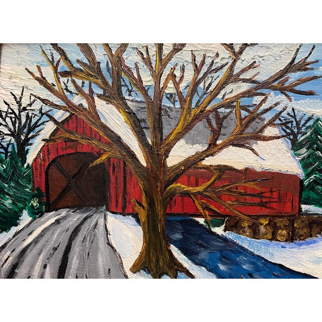 Framed oil on canvas board of a covered bridge in the snow. Initialed illegibly lower right and dated and titled on the...