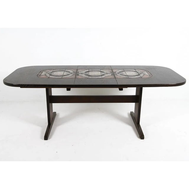 Danish dining table designed by Poul H. Poulsen, produced in Denmark circa the 1960s. The table is constructed of oak with...