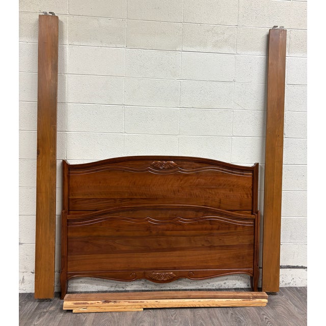 This is an absolutely beautiful vintage, possibly antique, full-sized Victorian style solid bed with leaf carvings....