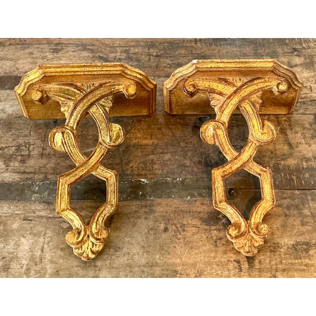Infuse your walls with the sophisticated charm of this exquisite pair of vintage Italian gilt wall brackets. Masterfully...