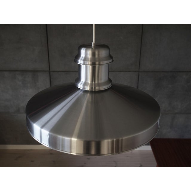 The lamp was made in the 1970s, Danish production. Made of aluminium in silver colour. The unique construction is not only...