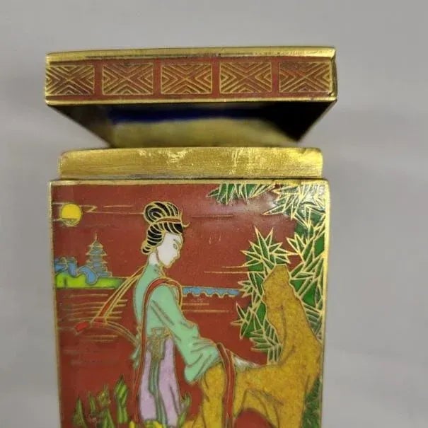 Small warm red cloisonne tea box with gold gilding. The caddy features 4 different scenes of Chinese beauties at leisure...
