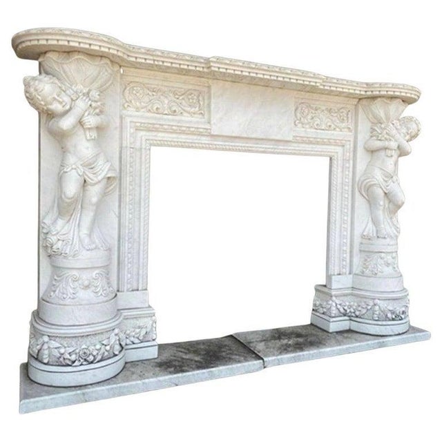 This exquisite hand-carved marble fireplace features beautifully detailed statues of children, adding a touch of charm and...