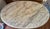 A French Provincial style oval center table with a genuine Italian marble top — the marble is stamped "ITALY" on the...