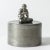 Amazing pewter jar by Nils Fougstedt, adorned with a flute playing, cross-legged Pan figurine. The tiny flute is made from...