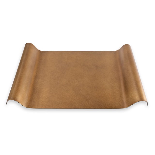 Modern with a nod toward industrial, our Quinton metal tray is a stand out. The curved shape is accented with four metal...