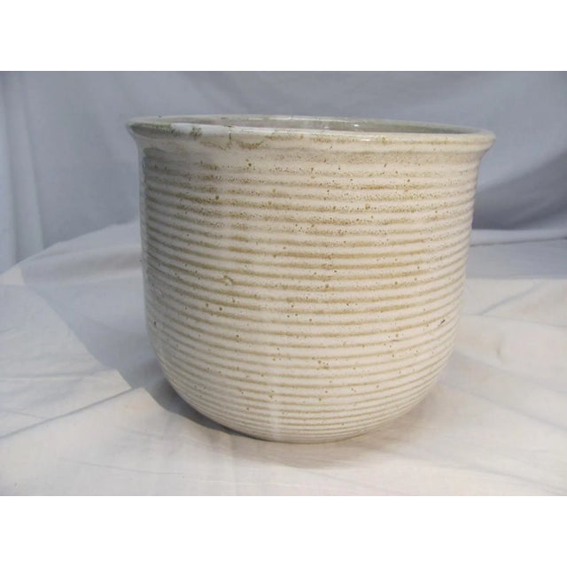 Very nice ZANESVILLE STONEWARE Co. 8.5" diameter cream colored Vase with a gently rounded bottom. Horizontal ribbed...