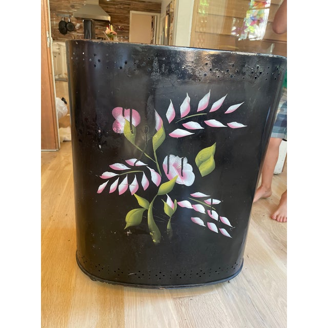 Floral hand-painted laundry bin that has been in our family since the 20’s. Has air holes at bottom to breathe.
