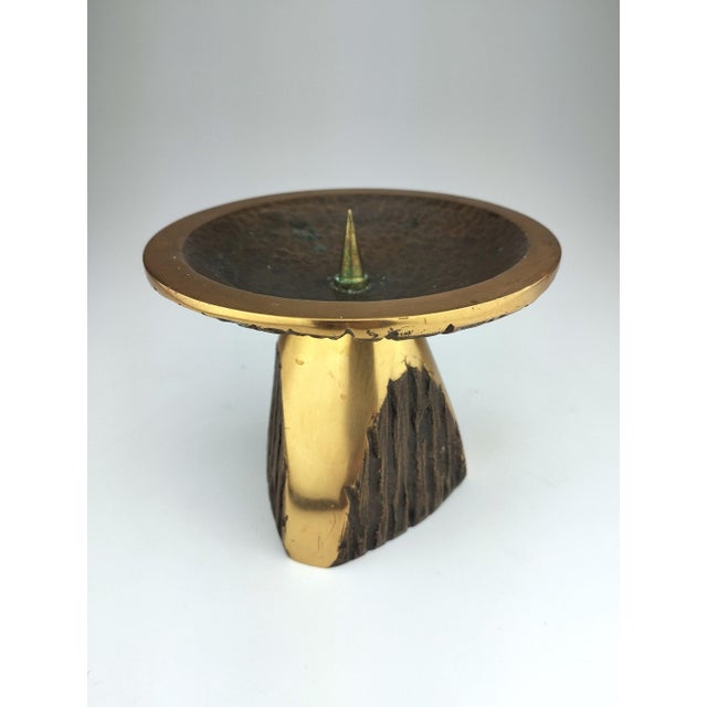 The captivating interplay of polished and organically textured surfaces characterizes this heavy bronze casting from the...