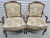 Pair of 1930's French Louis XV style bergere chairs with hand carved rosettes and a pastel tapestry upholstery. Chairs are...