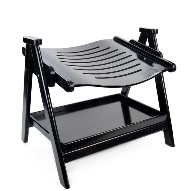 A practical wooden chair featuring a removable lower shelf, allowing the piece to be folded when needed. Thanks to its...