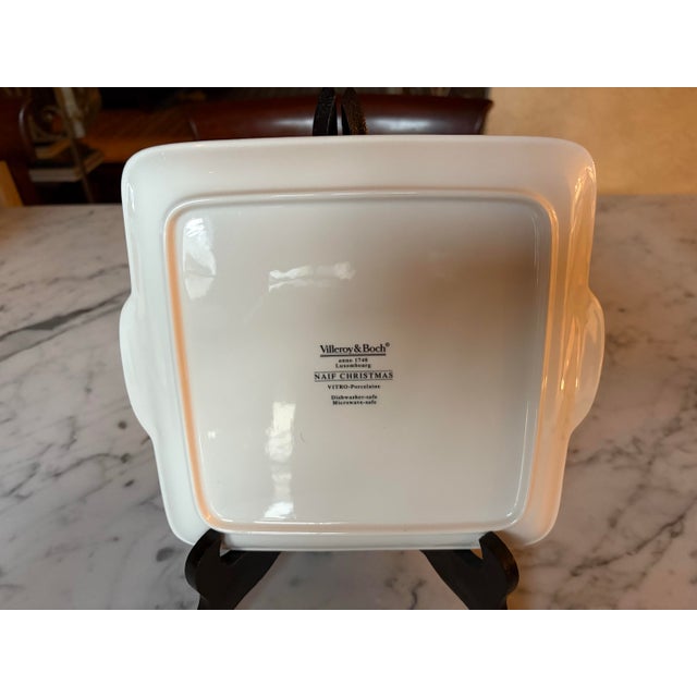 Measures 8” by 8” not including handles,