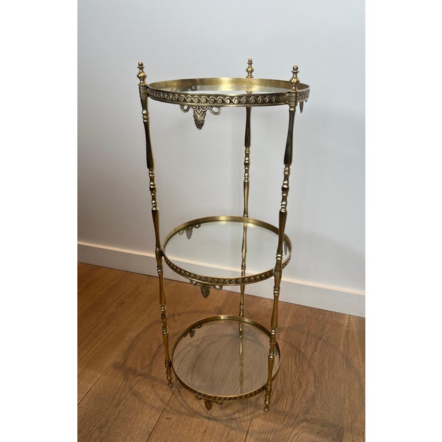 Neoclassical 1940s Round brass pedestal table with three glass shelves. French work Attributed to Maison Jansen For Sale - Image 3 of 9