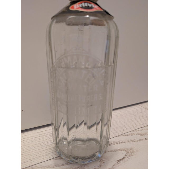 Glass and plastic seltzer siphon. Still usable.