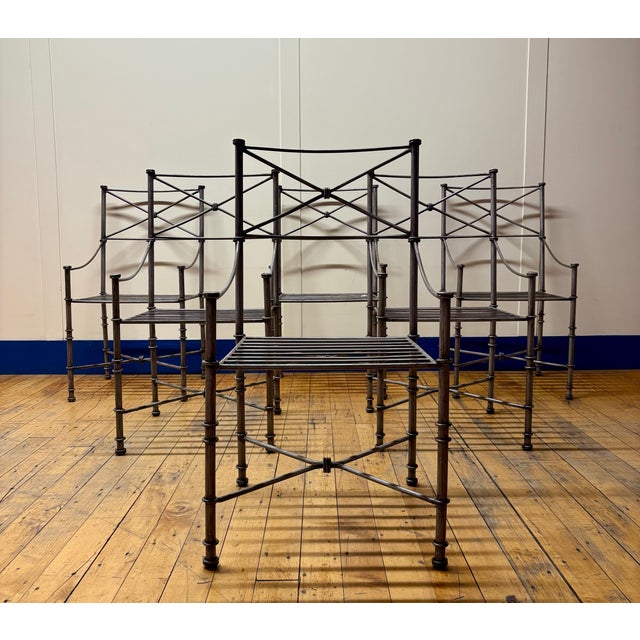 Desirable set of Neoclassical/Giacometti-inspired heavy wrought iron set of six dining chairs featuring ring-turned legs,...