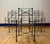Desirable set of Neoclassical/Giacometti-inspired heavy wrought iron set of six dining chairs featuring ring-turned legs,...