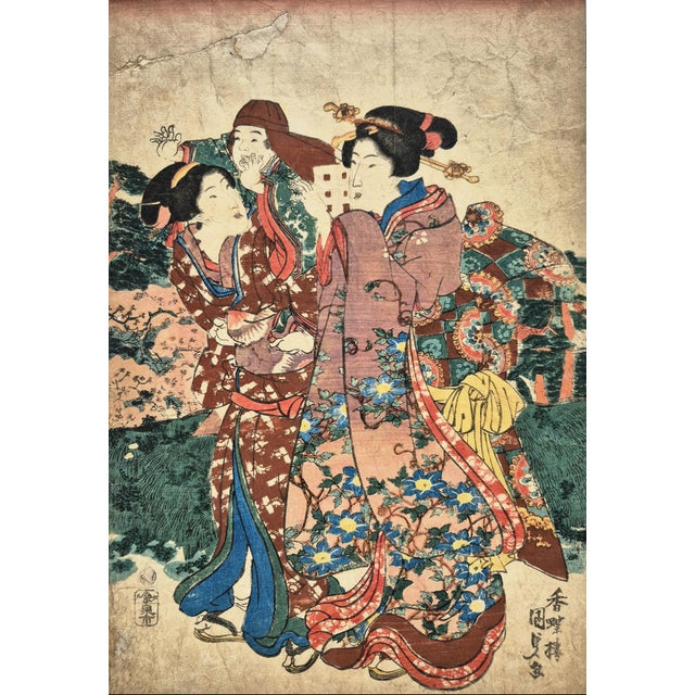 Edo era Japanese woodblock print of Bijin-ga (picture of beautiful women) / Geishas in kimono holding a child by Utagawa...