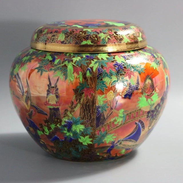Wedgwood Flame Fairyland Lustre Covered Vase. The body of the vase is decorated with the three repeating patterns. Fairy...