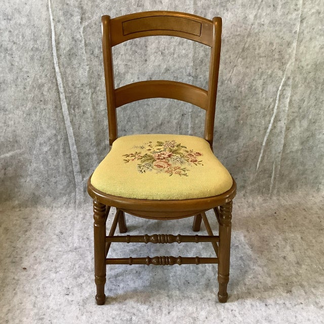 Vintage 50's Needlepoint chair. Turned legs and spindles, bowed back cross bar. Perfect for the small place where you put...