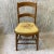 Vintage 50's Needlepoint chair. Turned legs and spindles, bowed back cross bar. Perfect for the small place where you put...