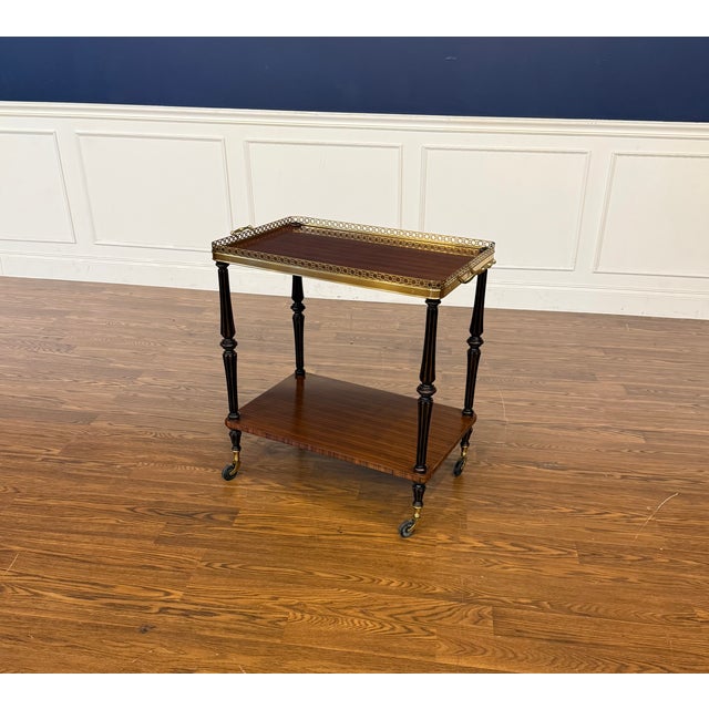 This is a serving cart/trolley by Leighton Hall Furniture. It features ebonized posts with exotic Pau Ferro wood for the...