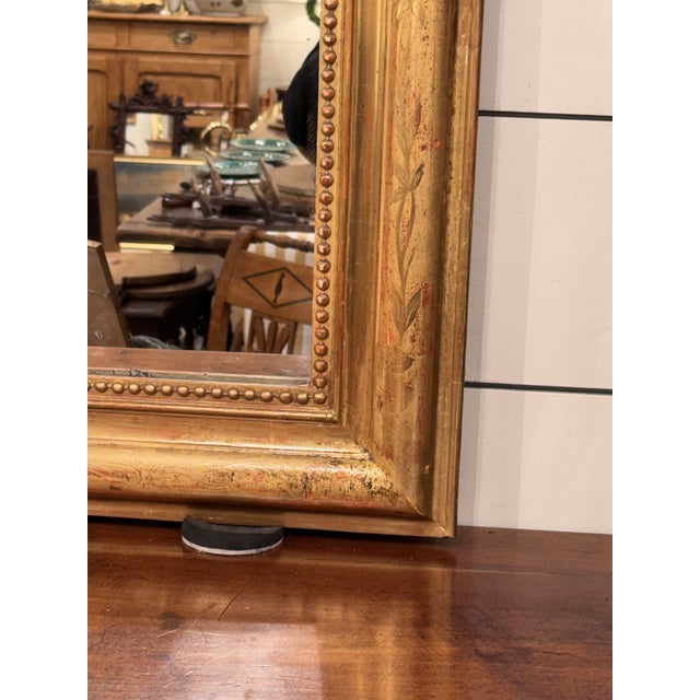 This is a beautiful mid sized gold leafed Louis Philippe mirror! This mirror holds to a simple quiet design without a lot...