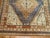 Large Gallery Size Khotan rug from the middle of the century with a geometric design in deep blue, burnt orange, and...