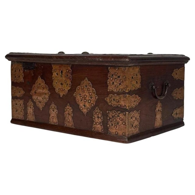 A distinctive 19th-century English storage box, finely constructed from oak and embellished with copper plating and...