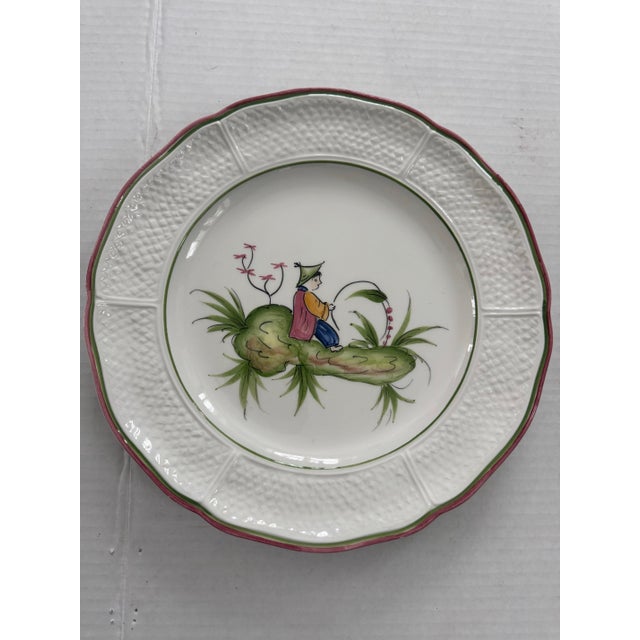 A beautiful set of six vintage chinoiserie plates hand painted in Italy. Each plate depicts a different playful scene in...