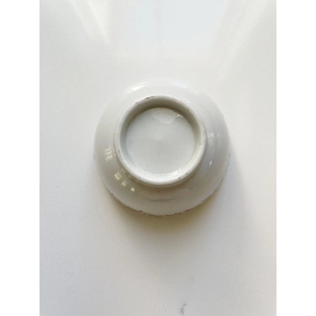 Antique Handleless Tea Cup. Estimated to be from the late 18th century. Hand painted floral design. Has a worn paint spot...