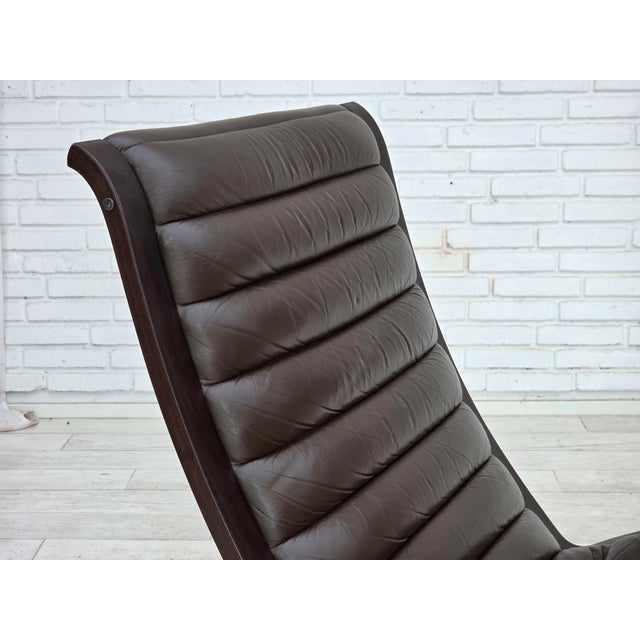 1970s, Danish design by Peter Hvidt & Orla Mølgaard for Fritz Hansen. Lounge chair in brown furniture leather, beech wood....