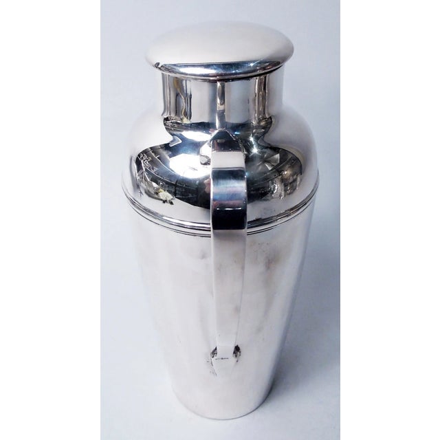 Art Deco sterling silver cocktail shaker. Made by Tiffany & Co. in New York, ca 1922. Tapering bowl, domed and girdled...
