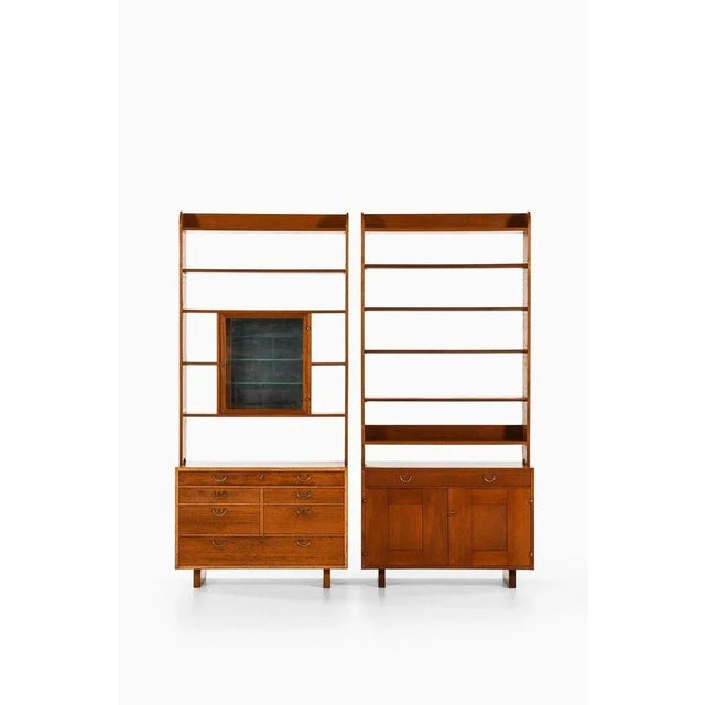 Pair of bookcases in mahogany, brass and mirrored glass by josef frank, 1950's additional information: material: mahogany,...