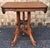 A late 19th Century Victorian Eastlake Style Carved Walnut Side Table Measures 28" in width, 20" in depth and 29" in height.
