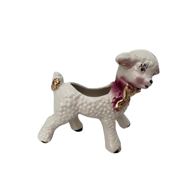 A charming vintage figural ceramic planter modeled in the form of a sweet lamb, finished in a creamy white glaze with...